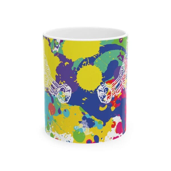 Introducing the **Splash Chipmunk Coffee Mug**: a white mug adorned with a vibrant, abstract design showcasing splashes of yellow, green, blue, and red paint. Amidst this colorful background, two intricate white designs resembling fish add an elegant touch.