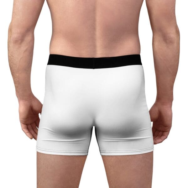 Back view of a person wearing Them Lips To Good Use Mens Boxer Briefs, featuring a white fabric with a black waistband.