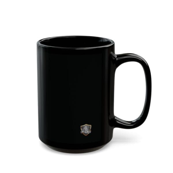 An Angry Cat Coffee Mug (11oz or 15oz) in black ceramic featuring a small, gold-colored emblem near the base.