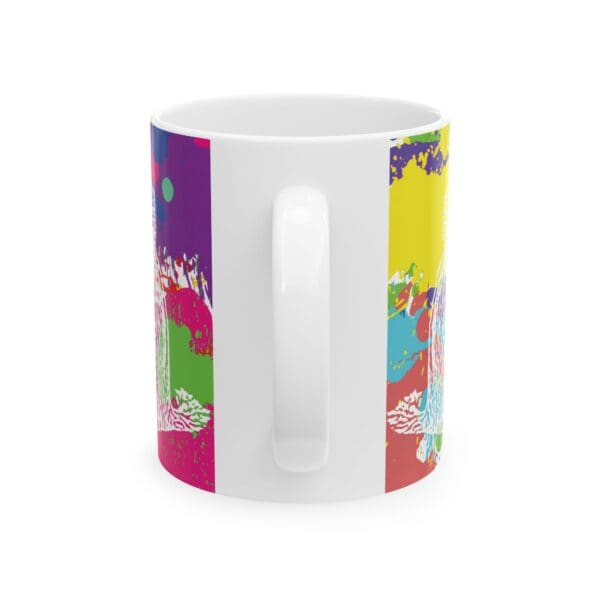 A white ceramic Splash Chipmunk Coffee Mug featuring a vibrant, multicolored abstract design. The handle is in the center of the image, with the colorful pattern visible on either side.