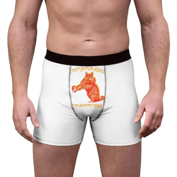 A person wearing Them Lips To Good Use Men's Boxer Briefs, which are white with a black waistband and feature an illustration of a horse along with the text "PUT YOUR JUNK TO GOOD USE" on the front.