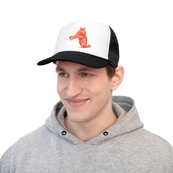 Man in a gray hoodie wearing the Chipmunk Trucker Hat featuring a white and black color scheme with a red fox design on the front.