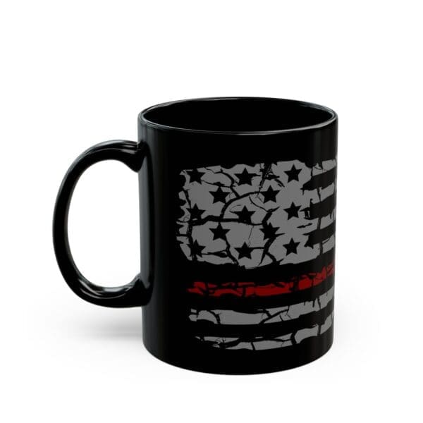 The Firefighter Support Coffee Mug is a black coffee mug that features a distressed American flag design with a single red line across the middle.