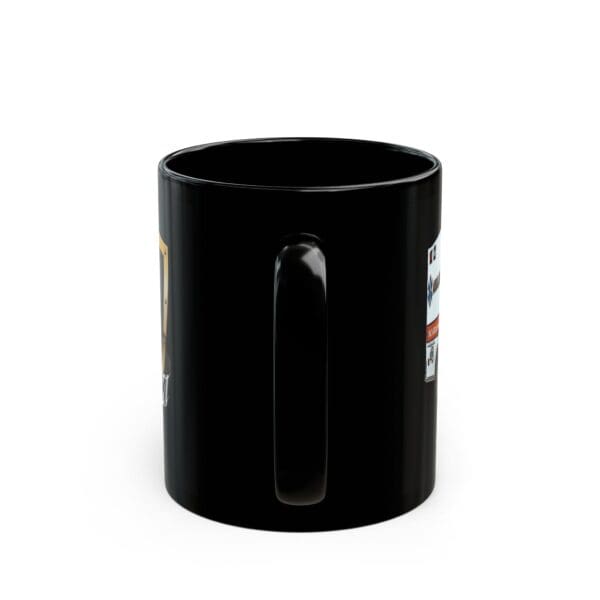 The Ambulance Coffee Mug is a black ceramic mug with a handle, partially displaying a vibrant design with colorful graphics on its side.