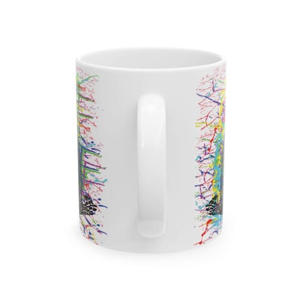 Cracked Chipmunk Coffee Mug featuring abstract, colorful splatter designs on both sides, shown from the back with the handle visible in the center.