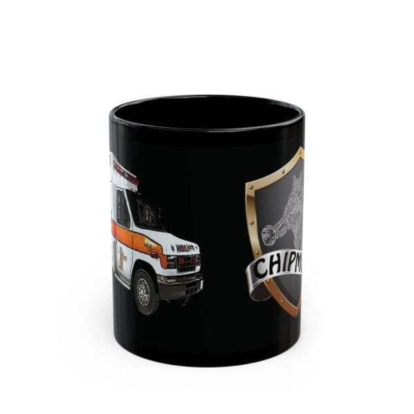 A black Ambulance Coffee Mug featuring an image of an ambulance on one side and a shield emblem with "CHIPM" written on it on the other side.