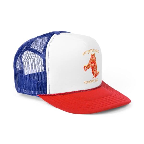 The "Put Your Lips To Good Use" Trucker Hat showcases a red image of a bear holding a trumpet on its white front panel, complemented by a blue mesh back and red brim, along with the matching text "Put your lips to good use.