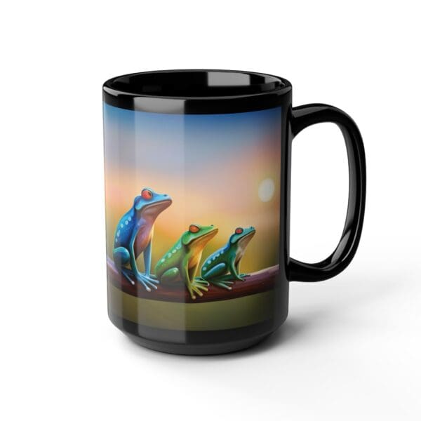 The Colorful Frogs Coffee Mug, available in 11oz and 15oz sizes, showcases a vibrant illustration of three frogs perched on a branch with a stunning sunset backdrop.