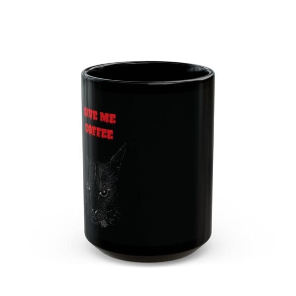 An Angry Cat Coffee Mug featuring a black design with a graphic of a cat's face and the text "GIVE ME COFFEE" in red, available in both 11oz and 15oz sizes.