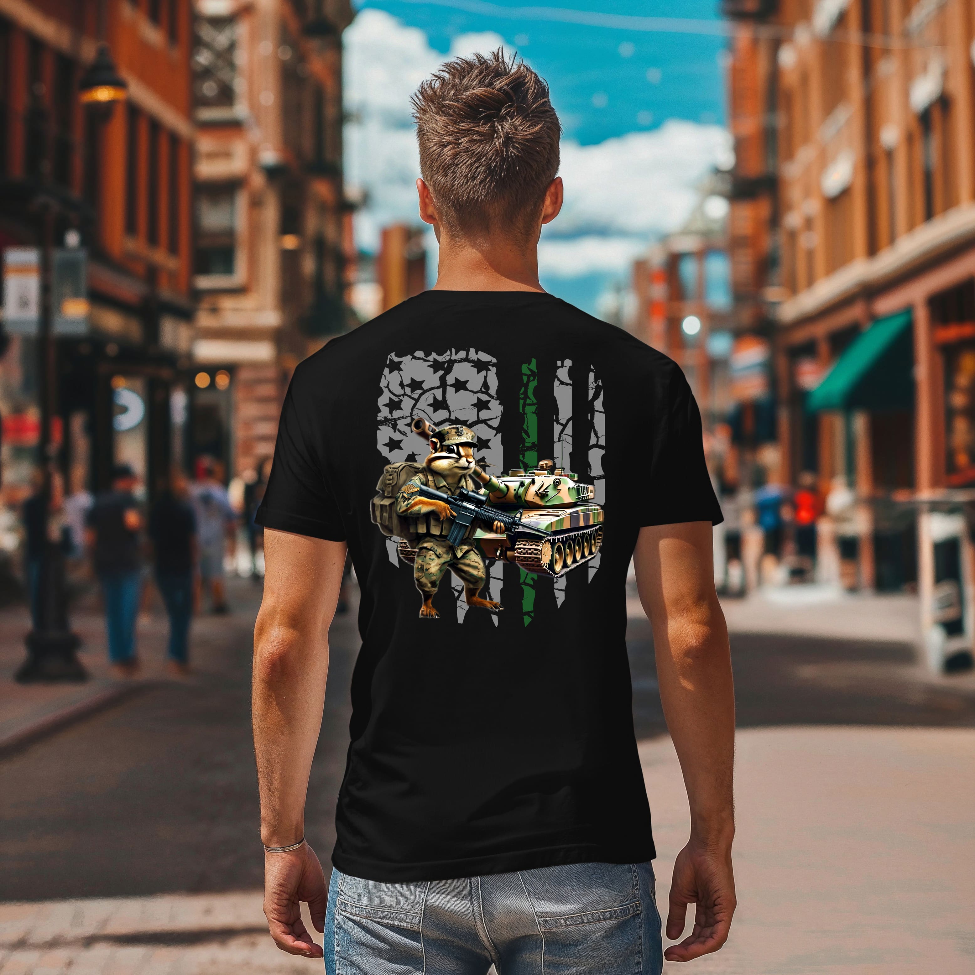 A man wearing the Chipmunk Battle T-shirt, which features a graphic of a soldier and a tank, walks down a city street with people and buildings in the background.