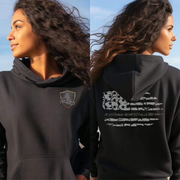 A woman wears a Correctional Officer Support Hoodie featuring a "Chipmunks" logo on the front and a stylized American flag on the back. She stands outdoors with her hair blowing in the wind.