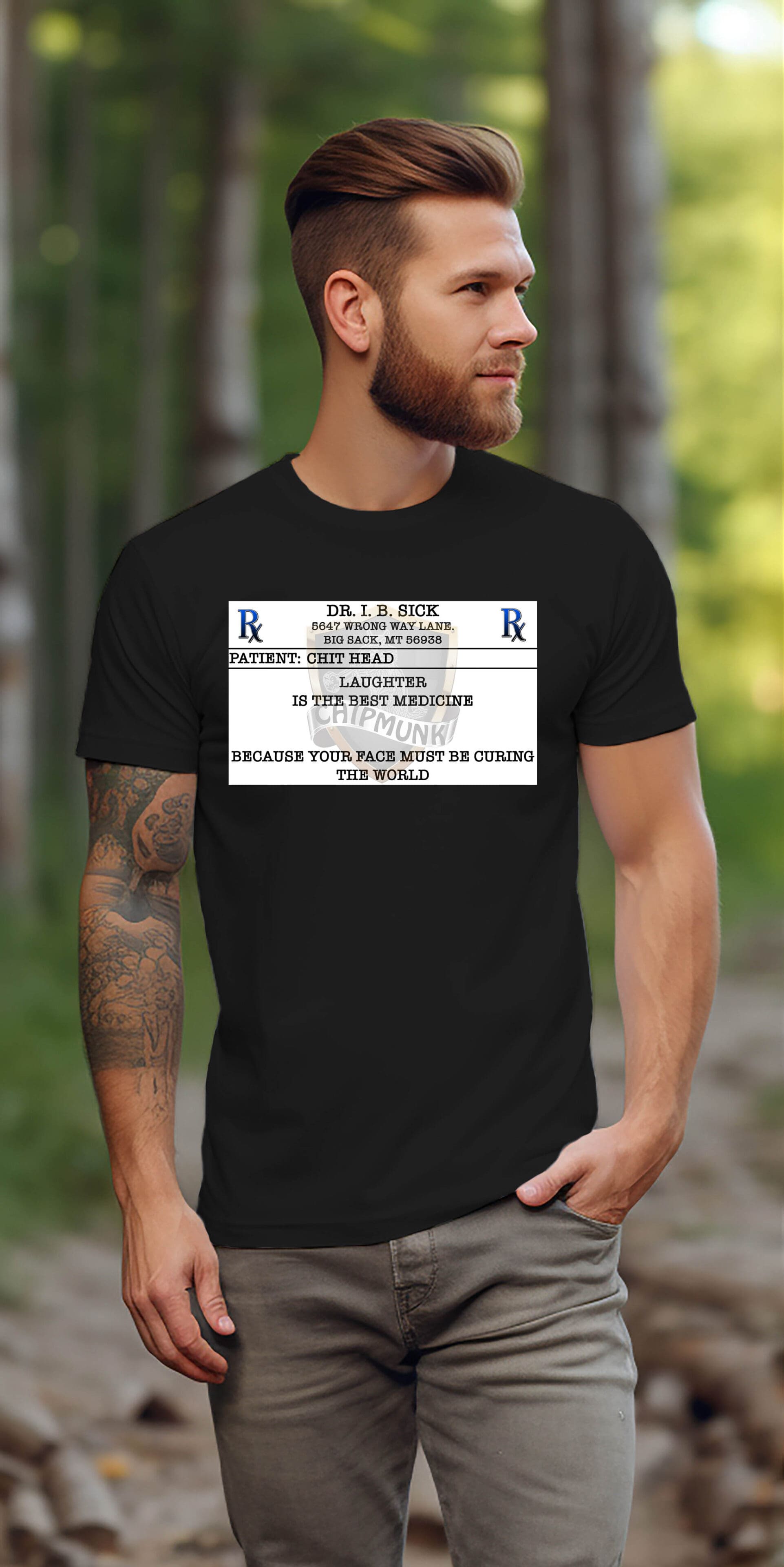 A man with a beard and tattooed arm walks outdoors wearing a Laughter T-Shirt. The black shirt features a humorous prescription design that reads, "Dr. I.B. Sick: Rest and cake because your face must be curing the world.