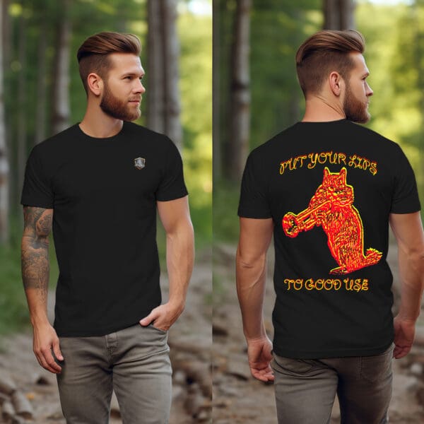 A bearded man is strolling through a forest, clad in a black "Put Your Lips To Good Use" T-shirt featuring a logo on the front. The back of the shirt showcases an intense graphic of a bear engulfed in flames, accompanied by the text, "PUT YOUR HITS TO GOOD USE.