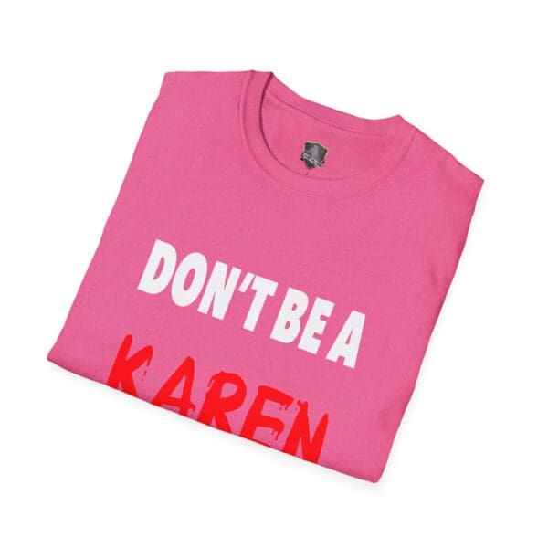 Folded pink T-shirt featuring the bold white and red text "DON'T BE A KAREN," from the "Don't Be a Karen" collection.