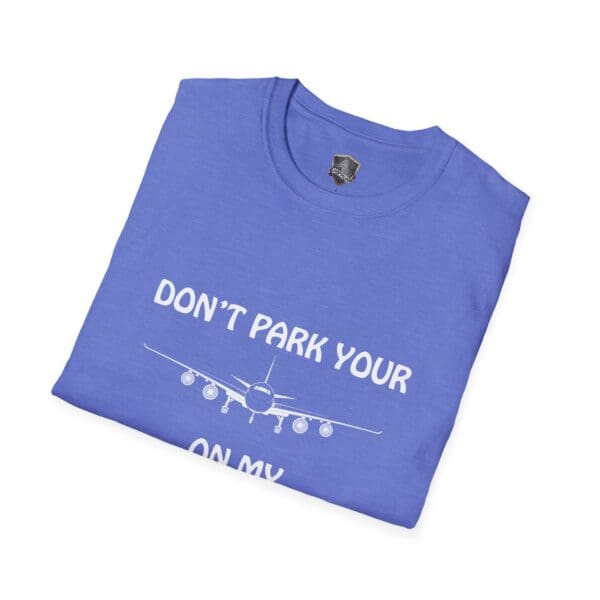 Blue folded t-shirt featuring an airplane graphic and the text "DON'T PARK YOUR PLANE ON MY DINGY," known as the Don't Park Your Plane On My Dingy T-Shirt.