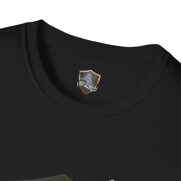 Close-up of a black Nothing T-Shirt featuring a small "Chipmunk" logo and shield emblem on the inside neck area.