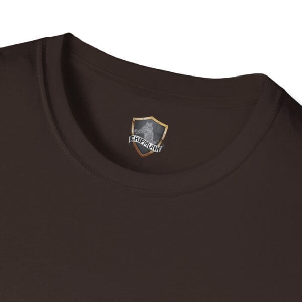 A close-up of the neckline of the Guiding Star Tee Shirt, displaying a label adorned with a shield graphic and the word "Chipmunk.