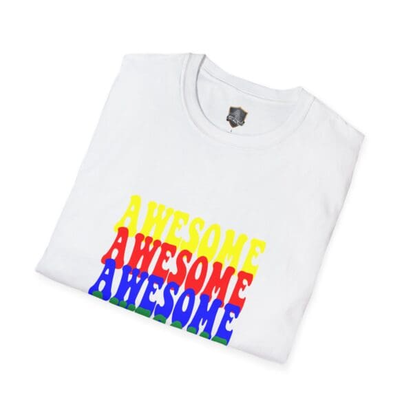 Folded white Awesome Shirt with "AWESOME" printed three times in yellow, red, and blue colors stacked on top of each other.