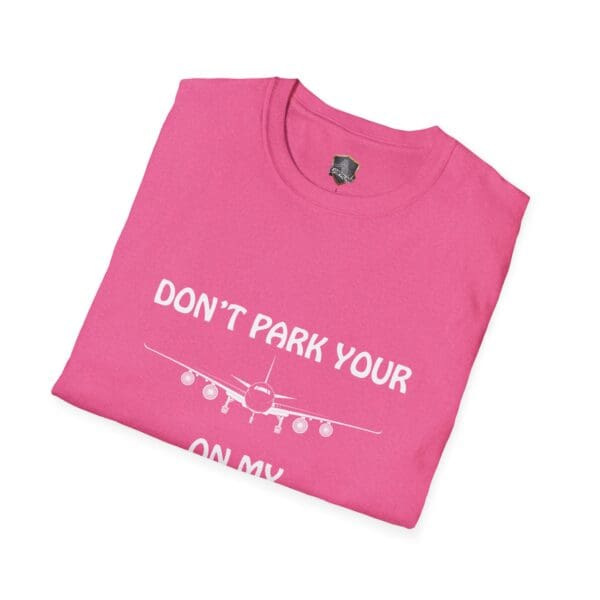 Pink t-shirt featuring a white airplane graphic with the text "DON'T PARK YOUR PLANE ON MY DINGY.