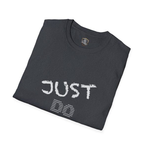 A folded dark T-shirt featuring "JUST DO YOUR JOB!" in block letters on the front.