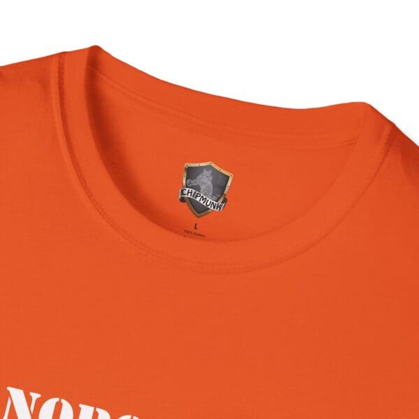 Close-up of the neckline of an orange "Nobody Is Perfect" Statement T-Shirt featuring a Chipmunk logo and sizing label on the inside collar.