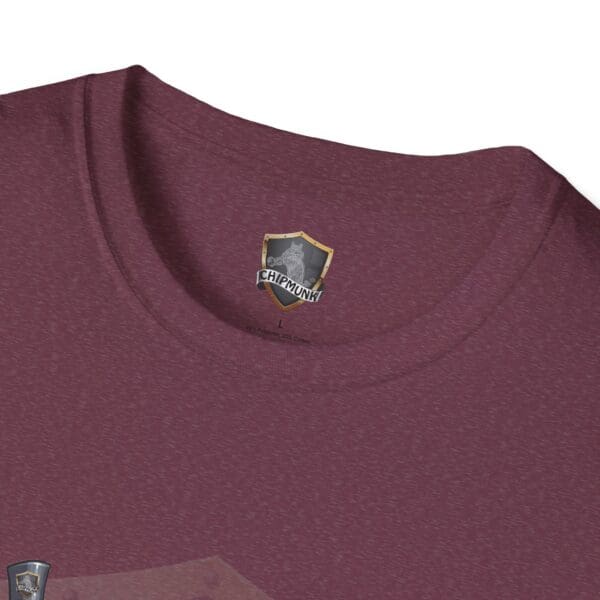 A close-up of the Admission T-Shirt in maroon, featuring a shield logo with a chipmunk design near the neckline.