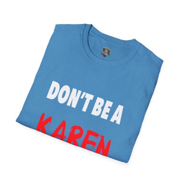 A folded blue t-shirt showcasing the text "Don't Be a Karen" in bold letters.