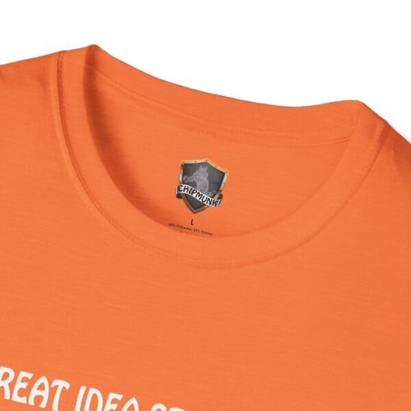 Close-up of an orange Great Idea T-Shirt featuring a Chipmunk brand label inside the collar, with partially visible white text at the bottom.