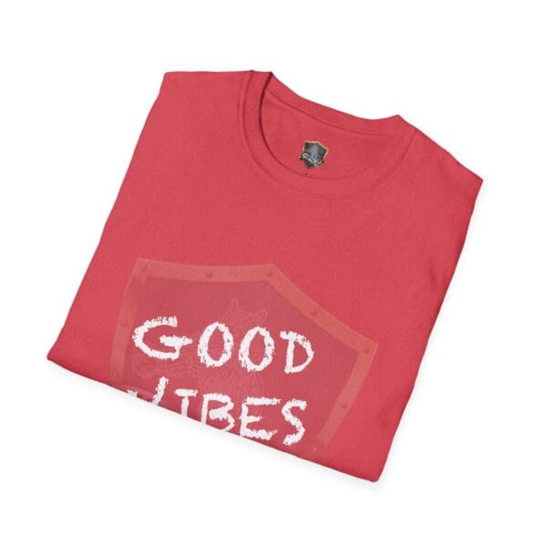 A folded shirt in red featuring the phrase "Good Vibes Only" on the front.