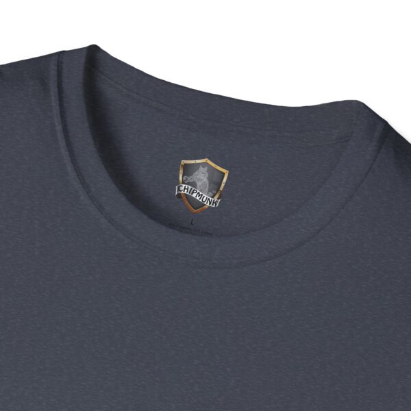 Close-up of a dark gray T-shirt's neckline, showcasing a label with the logo and the phrase "George the Roadie's Iconic Icebreaker T-Shirt: 'I Didn't Do It! I Was Framed!!!