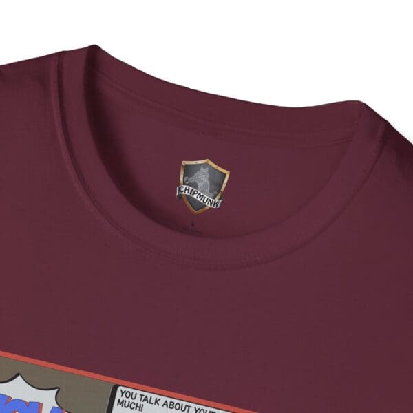 Close-up of a maroon "Overt Narcissism - Forgetting Myself Graphic Tee" featuring a graphic design with text near the bottom edge. A tag labeled "Chipmunk" is visible inside the collar.