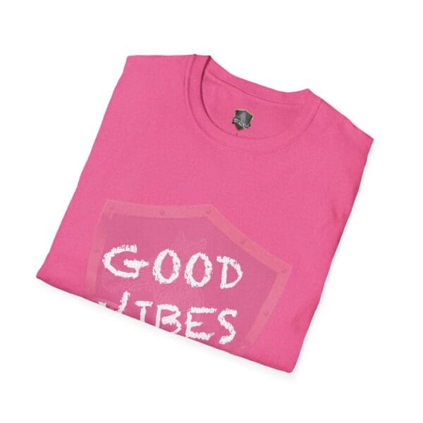 Pink folded t-shirt featuring the "Good Vibes Only" design in white text.