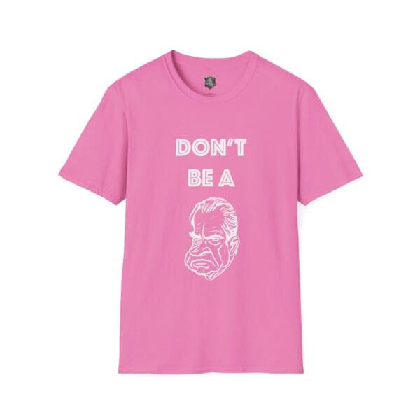 Don't Be A... Tee featuring the text "DON'T BE A" above a stylized illustration of a frowning man's face in white on a pink T-shirt.