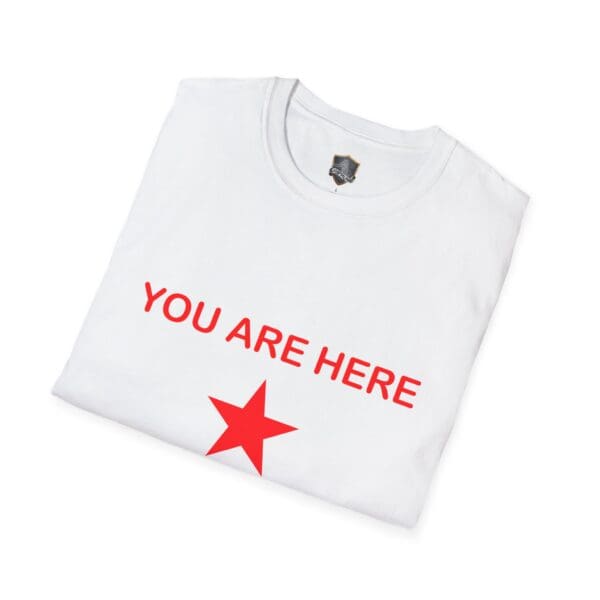 Folded Guiding Star Tee Shirt in white featuring a red star and the text "YOU ARE HERE" printed in red.