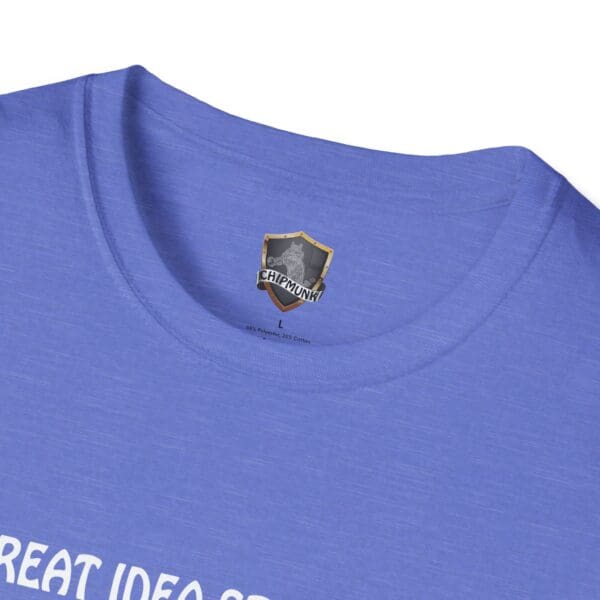 Close-up of a blue Great Idea T-Shirt featuring a Chipmunk logo. The visible text on the collar reads, "GREAT IDEA," although part of it is obscured at the bottom.