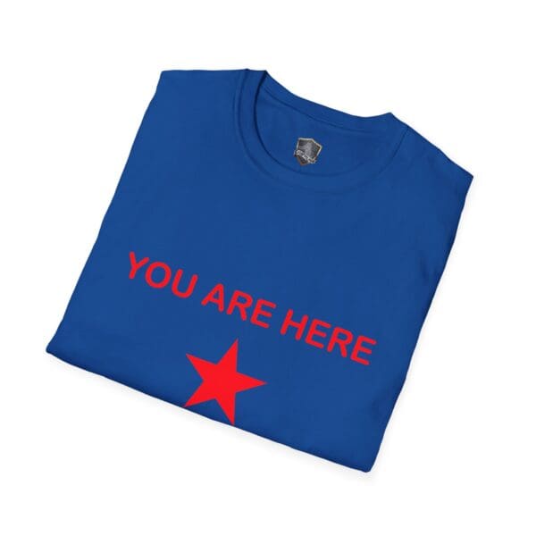 Guiding Star Tee Shirt in blue, featuring the red text "YOU ARE HERE" above a red star, neatly folded.