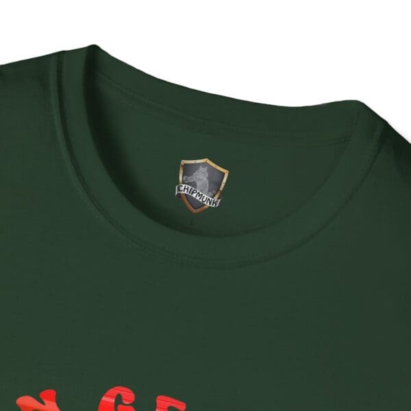 Close-up of the "C'mon George!! Retro Rainbow Roadie T-Shirt" in dark green, featuring a small label with a shield design and the word "Chipmunk." Partially visible red text is seen below the neckline.