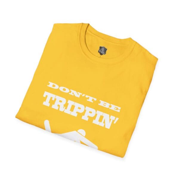 Yellow folded t-shirt featuring the product name "Don't Be Trippin'" in white text.