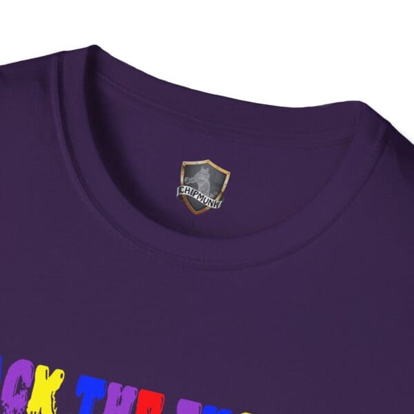 Close-up of the Colorful Angry Unicorn Tee, showcasing its vibrant printed badge and bold text on a purple fabric.