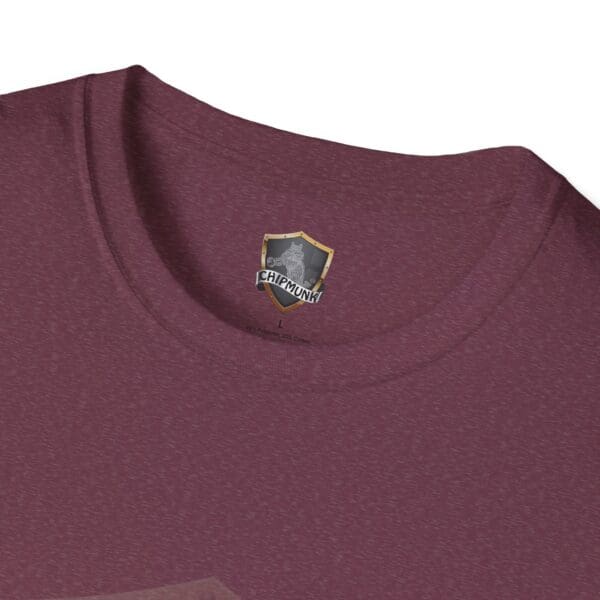 Close-up of the collar of the maroon "What I Forgot You Will Never Know" T-shirt, showcasing a small shield design with "Chipmunk" printed on the inner label.