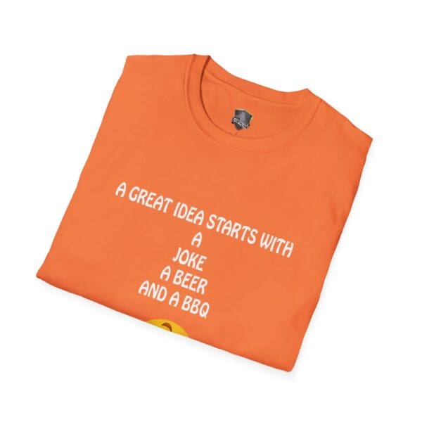 Folded orange Great Idea T-Shirt with the text: "A great idea starts with a joke, a beer, and a BBQ.