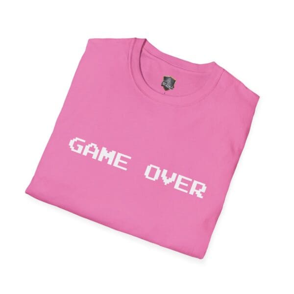 Game Over T-Shirt in pink, featuring a white pixelated "GAME OVER" text, neatly folded.