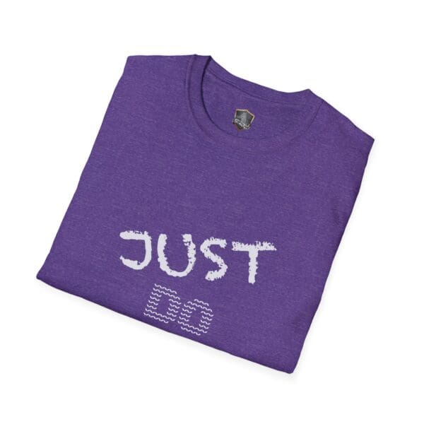 Purple "Just Do Your Job!" t-shirt featuring white text with a patterned design underneath, neatly folded.