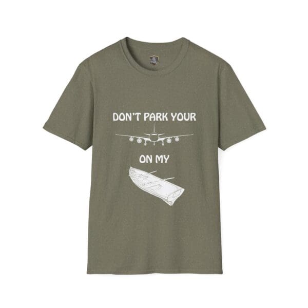 Green T-shirt featuring white text and illustrations of a plane and a log. Text reads "Don't park your plane on my dingy.