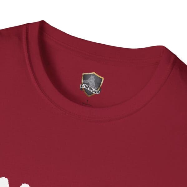 Close-up of a red t-shirt collar with a label displaying "Camel Tow" and a shield logo.