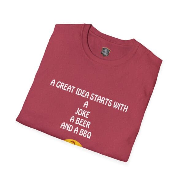 A folded maroon Great Idea T-Shirt featuring the text "A great idea starts with a joke, a beer, and a BBQ" printed in white.