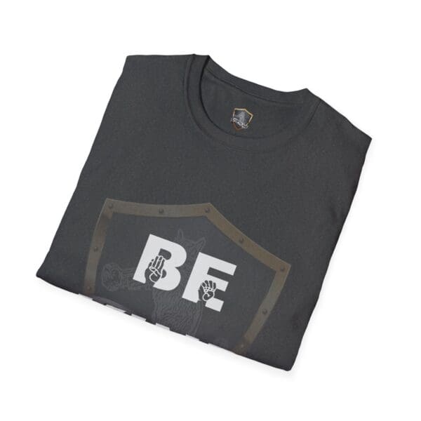 Folded dark t-shirt showcasing the "Be Kind in Sign Language" design with hand symbols on a shield background.