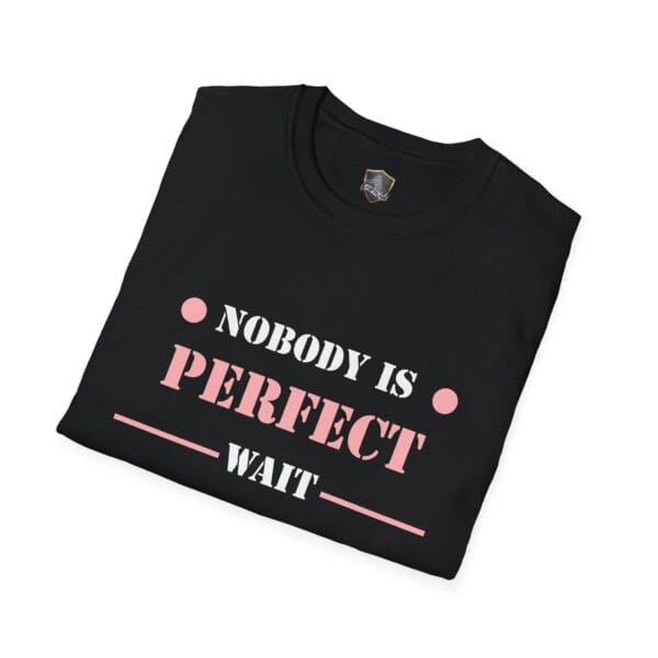 A folded black "Nobody Is Perfect" Statement T-Shirt featuring the text "Nobody is perfect, wait" in pink and white font.