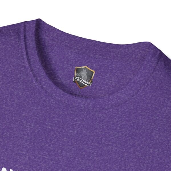 Close-up of a purple heather neck of the "Don't Park Your Plane On My Dingy" T-shirt, featuring a small shield-shaped logo with the text "Chipmunk" on the inner collar.