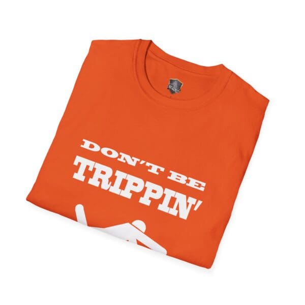 Don't Be Trippin'" T-Shirt in orange, featuring white text and a graphic of a person slipping.